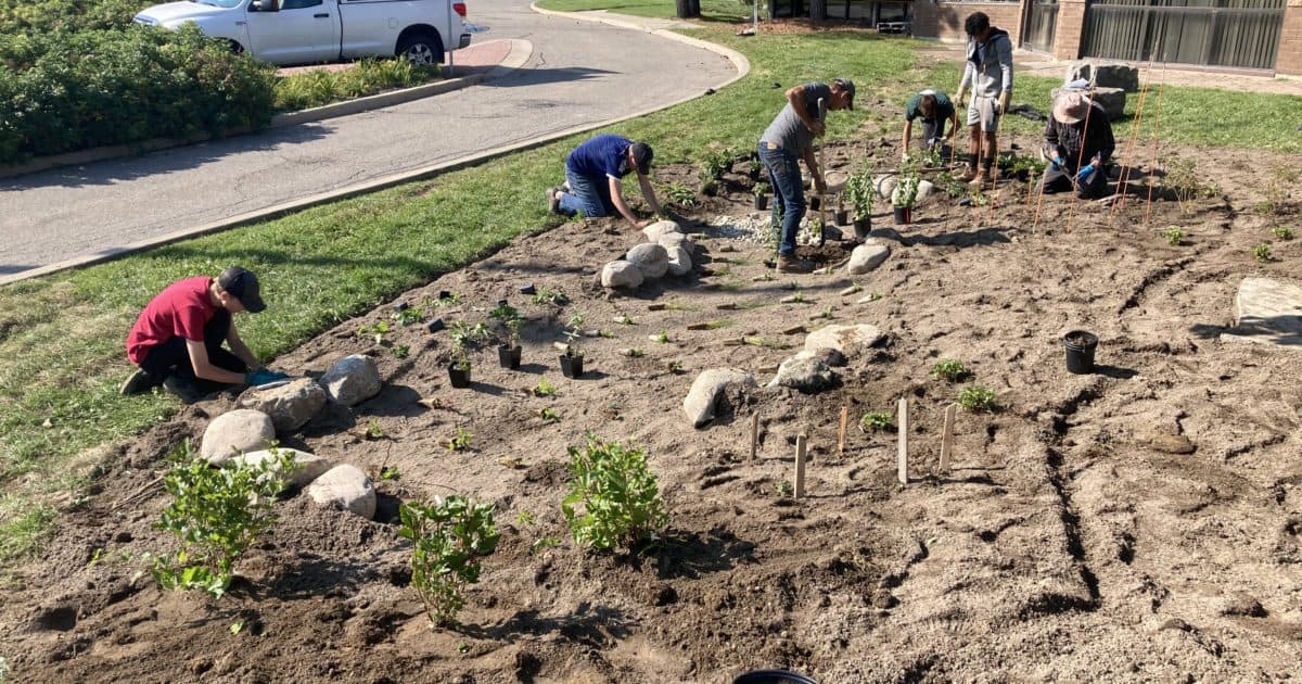 Volunteers planting a rain garden at CrossPoint Chruch