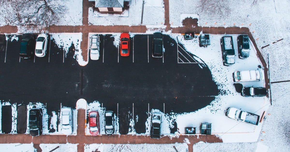 Birds-eye view of parking lot in winter.